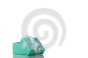 Opened beautiful mint colour gift box with bow isolated on white background