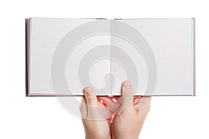 Opened book in hands