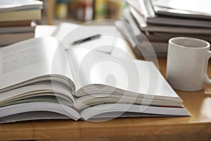 Opened book pile put on table