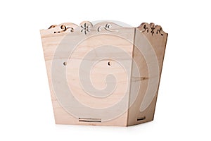 An opened box for multicolored toys, blocks and cubes, isolated on a white background. A wooden chest for playthings.