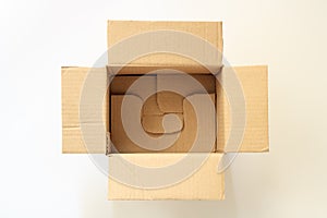 Opened brown paper carton box isolated on white background. Top