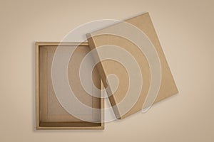 Opened cardboard box on a brown background
