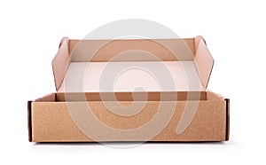 Opened cardboard box isolated on white background. Carton delivery packaging, one recycling brown box