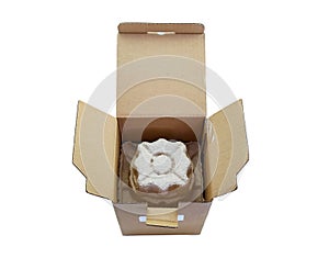 Opened cardboard box isolated on a white background. Inside is a paper fixation to protect round objects