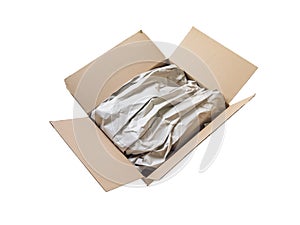 Opened cardboard postal delivery box with wrapping paper