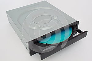 Opened CD - DVD drive with a black cap and blue disk.