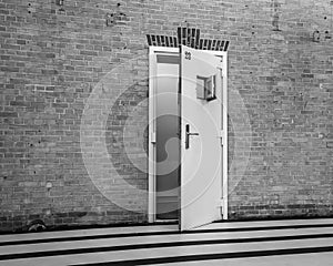 Opened cell door at an old prison