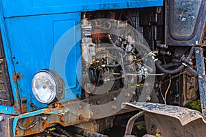 opened diesel engine compartment of old belarussian farm tractor