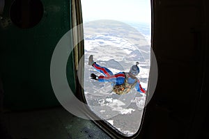 The opened door of an airplane. SKydiver has jumped out.