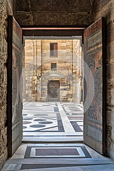 Opened door leading to the courtyard of Al-Sultan Al-Zahir Barquq mosque, Old Cairo, Egypt