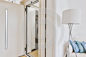 Opened elevator door in apartment