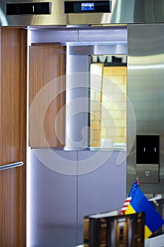 Opened elevator doors. Modern elevator with a mirror inside
