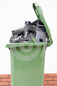 Opened garbage bin with electronics