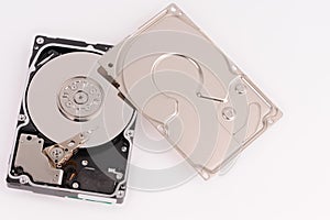 opened  hard disk drive on grey background