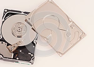 opened  hard disk drive on grey background