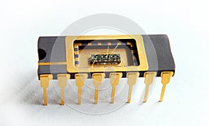 Opened IC with chip inside on the white background photo
