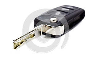 Opened ignition key with immobilizer on a white background
