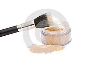 Opened jar with make-up powder and brush isolated