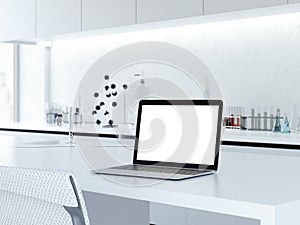 Opened laptop on a laboratory desk. 3d rendering