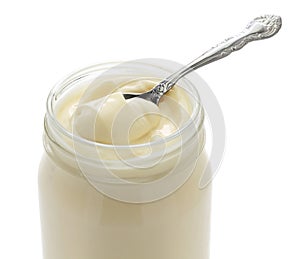 Opened mayonnaise jar and spoon