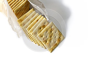 Opened package of saltine crackers photo