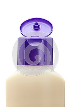Opened plastic bottle with soap or shampoo