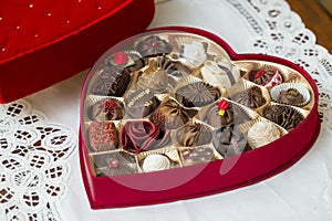 Opened red heart Valentine chocolate candy box with separate ind