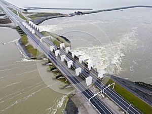 Opened sluices in a dyke draining water to the Waddenzee, Holland