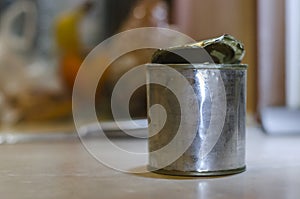 An opened tin with condensed milk