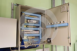 Opened ventilation system control box on the wall of the industrial ventilation room