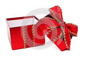 Opened white Christmas gift box with red bow and ribbon isolated