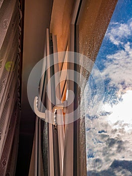 Opened white plastic window ventilation