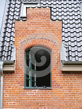 Opened window on a clinker house of Wiligrad castle