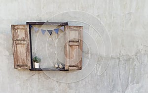 Opened wood window decorate on the old concrete wall which view in vintage style