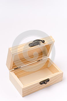 Opened wooden gift box over white background