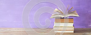 Openend book on purple background