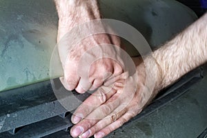 Opening the bonnet of car by groping hidden button