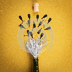 Opening bottle with tinsel simulating champagne