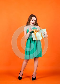 Opening the box. cyber monday concept. smiling child with birthday gift. childhood happiness. pretty teenage girl. kid