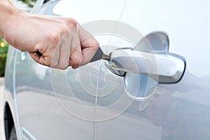 Opening a car door with a key