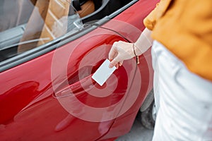 Opening car door with a plastic card