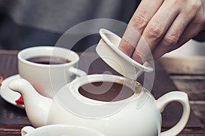 Opening a chinese teapot shows the lifestyle in slow and ease.