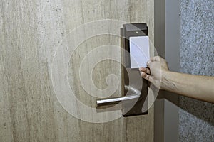 Opening door of room in hotel by proximity card, keyless to authenticate photo