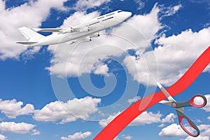 Opening Flights After COVID-19 Quarantine Concept. Scissors Cutting Red Ribbon in Front of Blue Cloudy Sky with White Modern