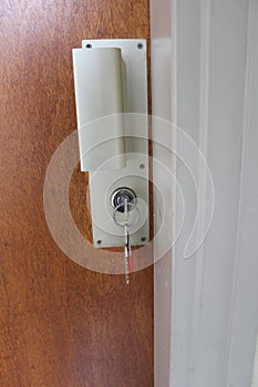 Opening a front door to house with key concept of security or new home