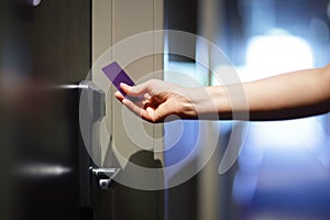 Opening hotel door with keyless entry card photo