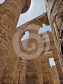 The opening hour at the Great Hypostyle Hall and clouds at the Temples of Karnak (ancient Thebes).