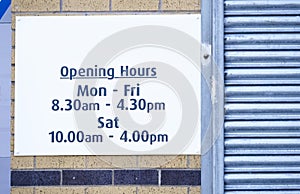 Opening hours of business sign Monday to Friday and Saturday