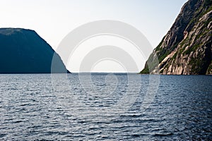 Opening from inland fjord between steep cliffs