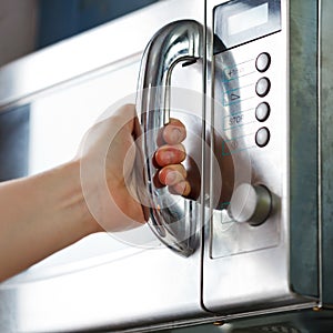 Opening of microwave oven door